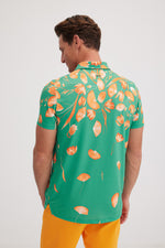 Botanica Golf Polo in Apricot Orange on Mint Green